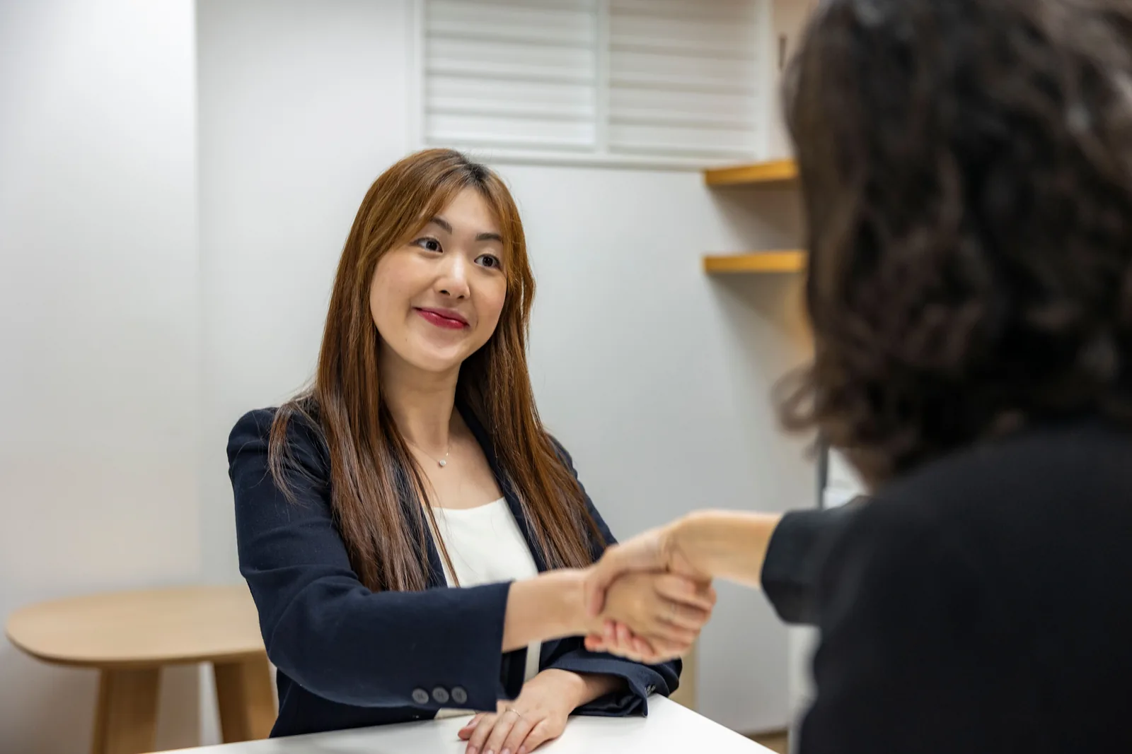 A staffing professional meeting with an employer